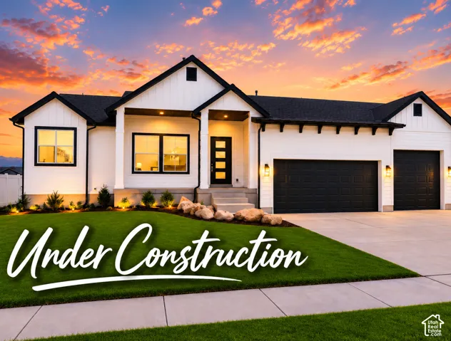 Modern farmhouse exterior featuring white board-and-batten siding, high-contrast dark window trim, a multi-car garage, and curated boulder landscaping