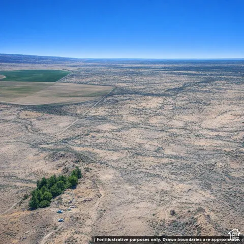 Expansive arid landscape featuring scattered vegetation