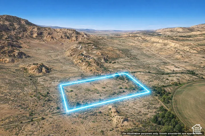 Expansive undeveloped lot featuring natural desert landscaping and distant mountainous terrain