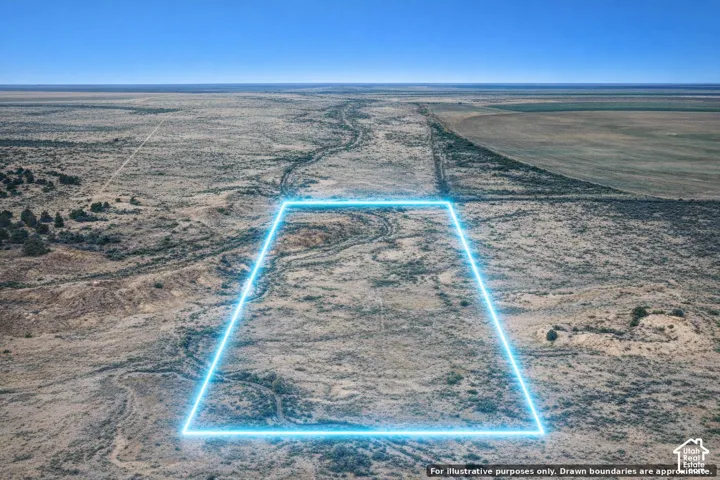 Expansive undeveloped land featuring a clear, open terrain and distant cultivated fields