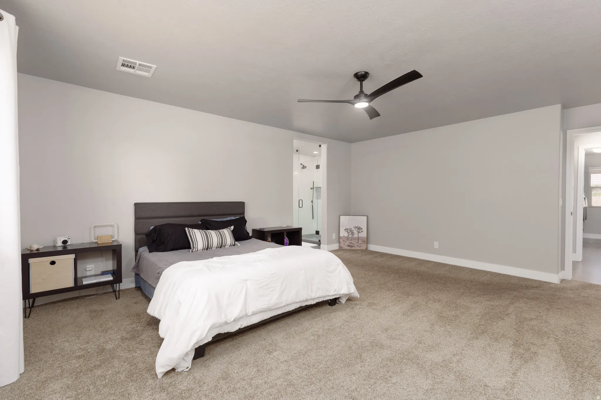 Large primary bedroom with custom ensuite bathroom