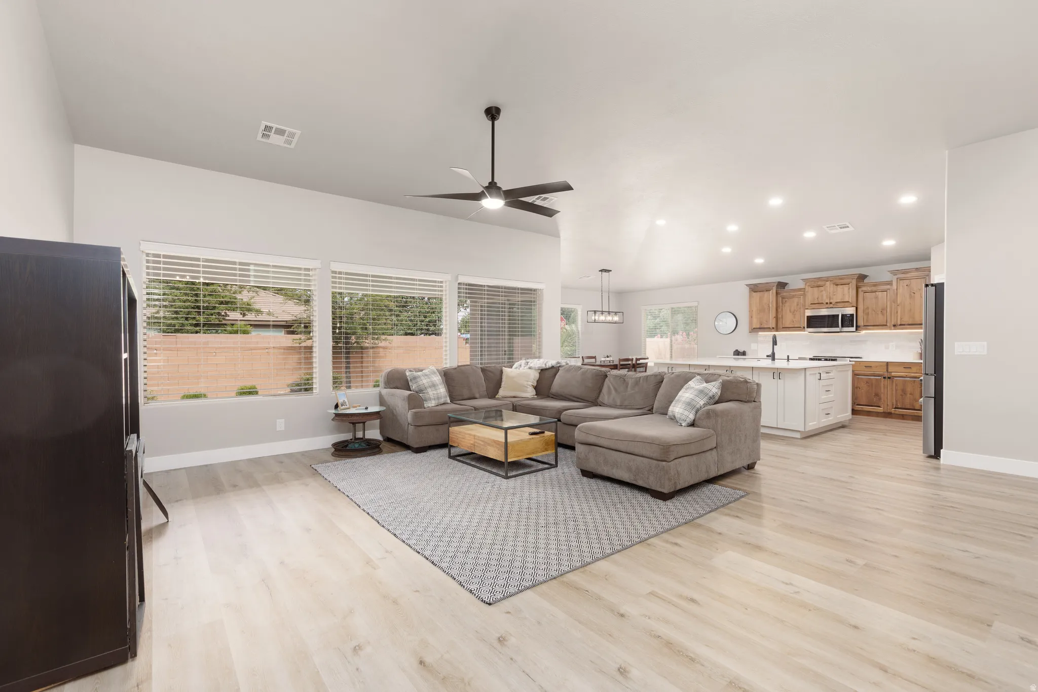 Open-concept living space featuring a spacious living room and kitchen