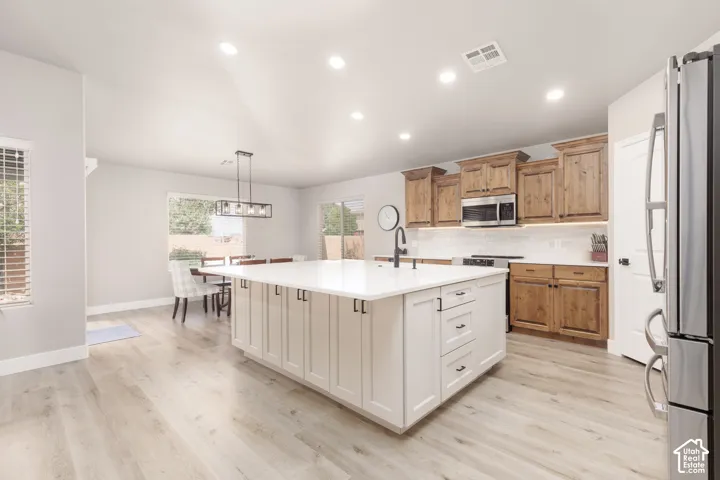 Large custom kitchen island with bar seating and lots of storage