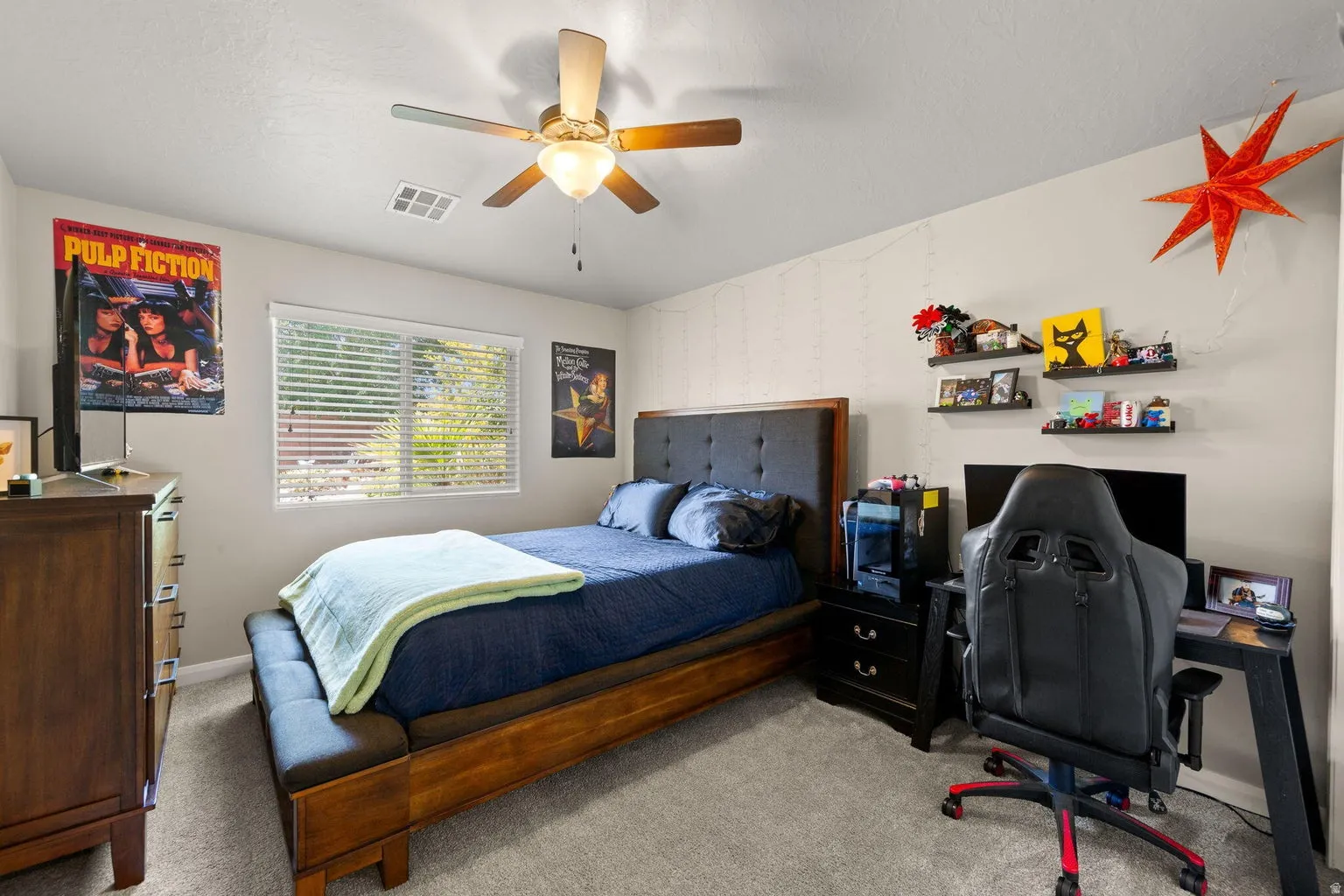 Bedroom featuring light gray carpet flooring and light-colored walls