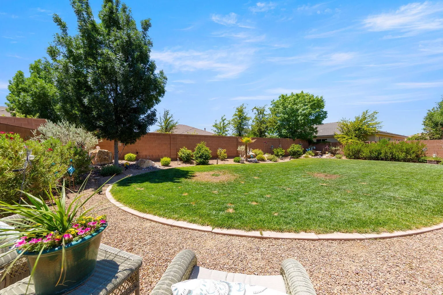 Expansive backyard featuring a well-maintained lawn