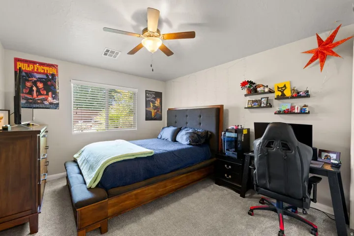 Bedroom featuring light gray carpet flooring and light-colored walls