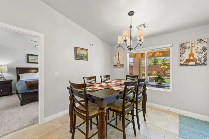 Dining area featuring a chandelier and tiled flooring