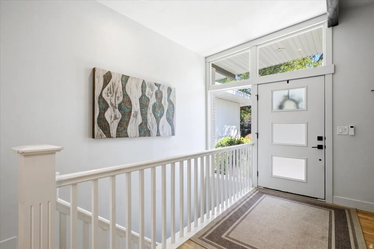 Contemporary entry door featuring three frosted glass panels and transom windows