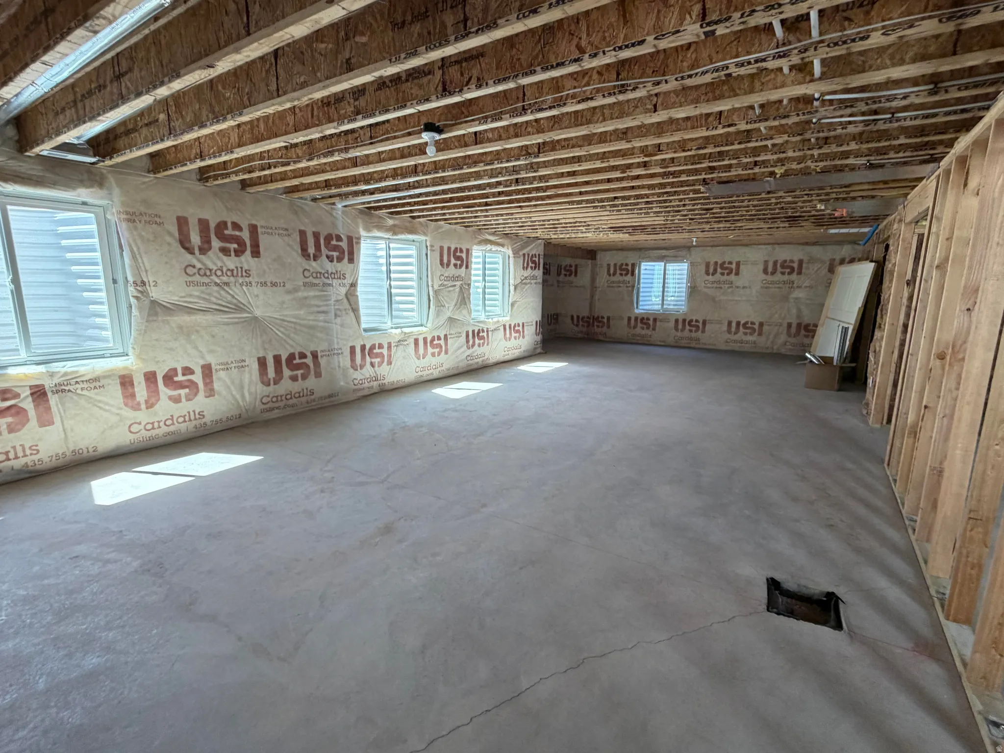 Unfinished basement space with plenty of room to add more living space, bedrooms, and a full size bathroom.