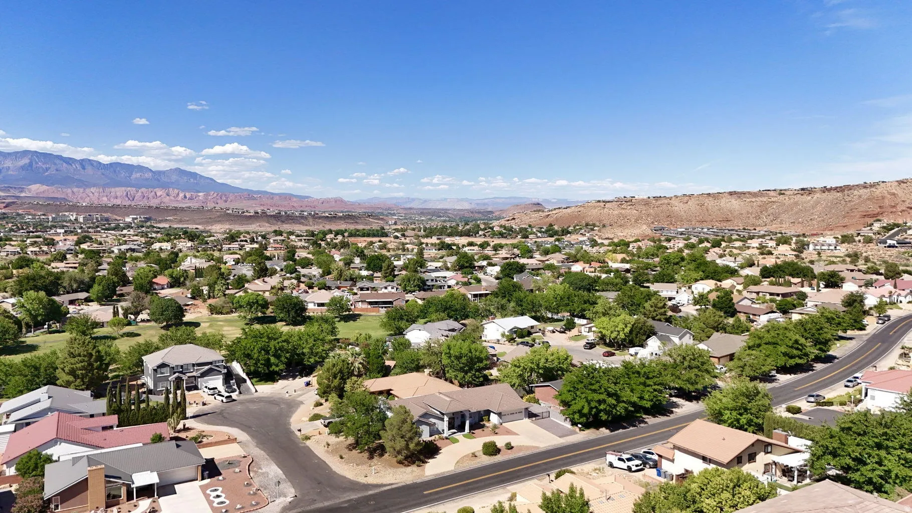 Expansive aerial perspective showcasing a residential neighborhood with varied architectural styles