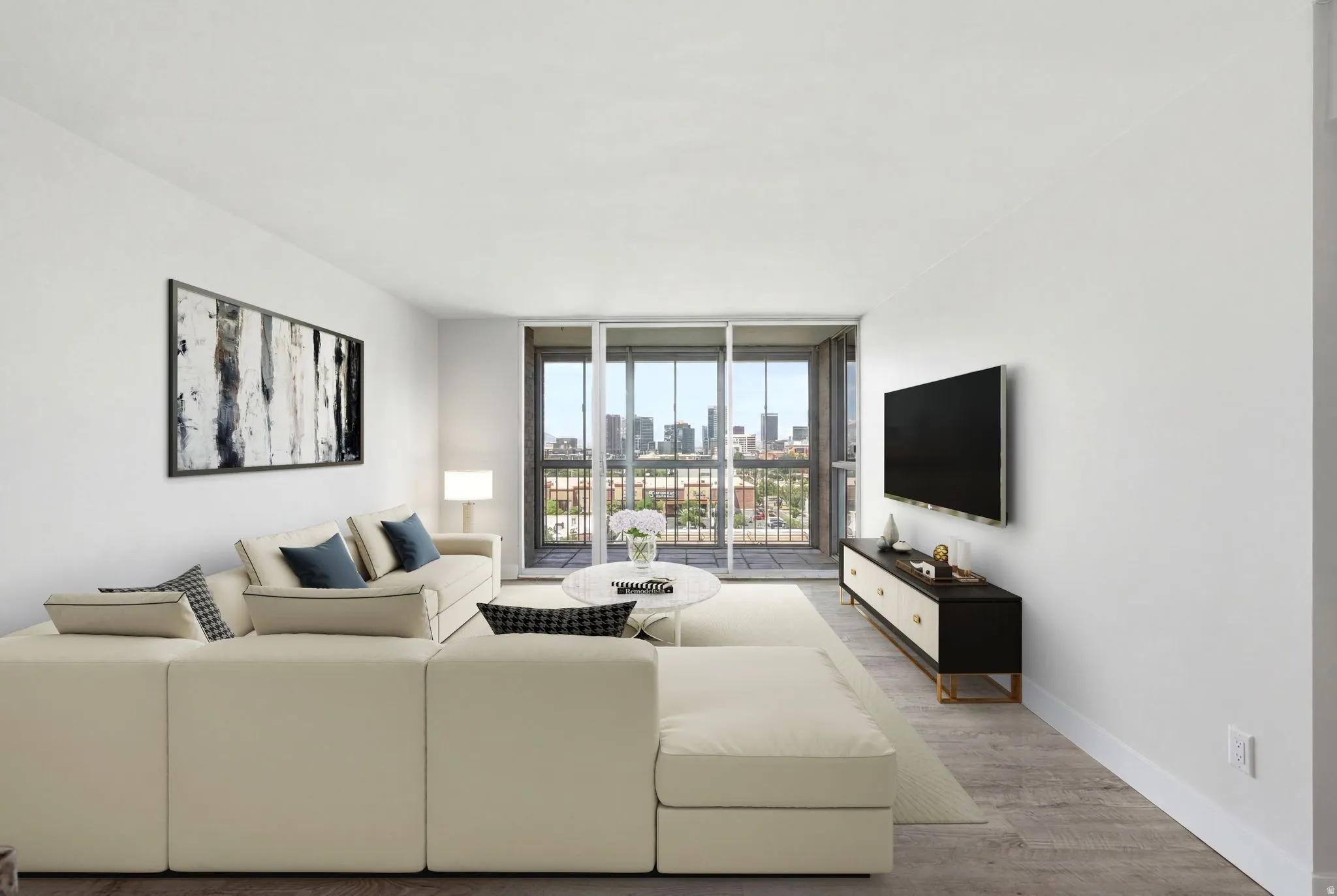 Open living area featuring wood-finish flooring and a glass slider