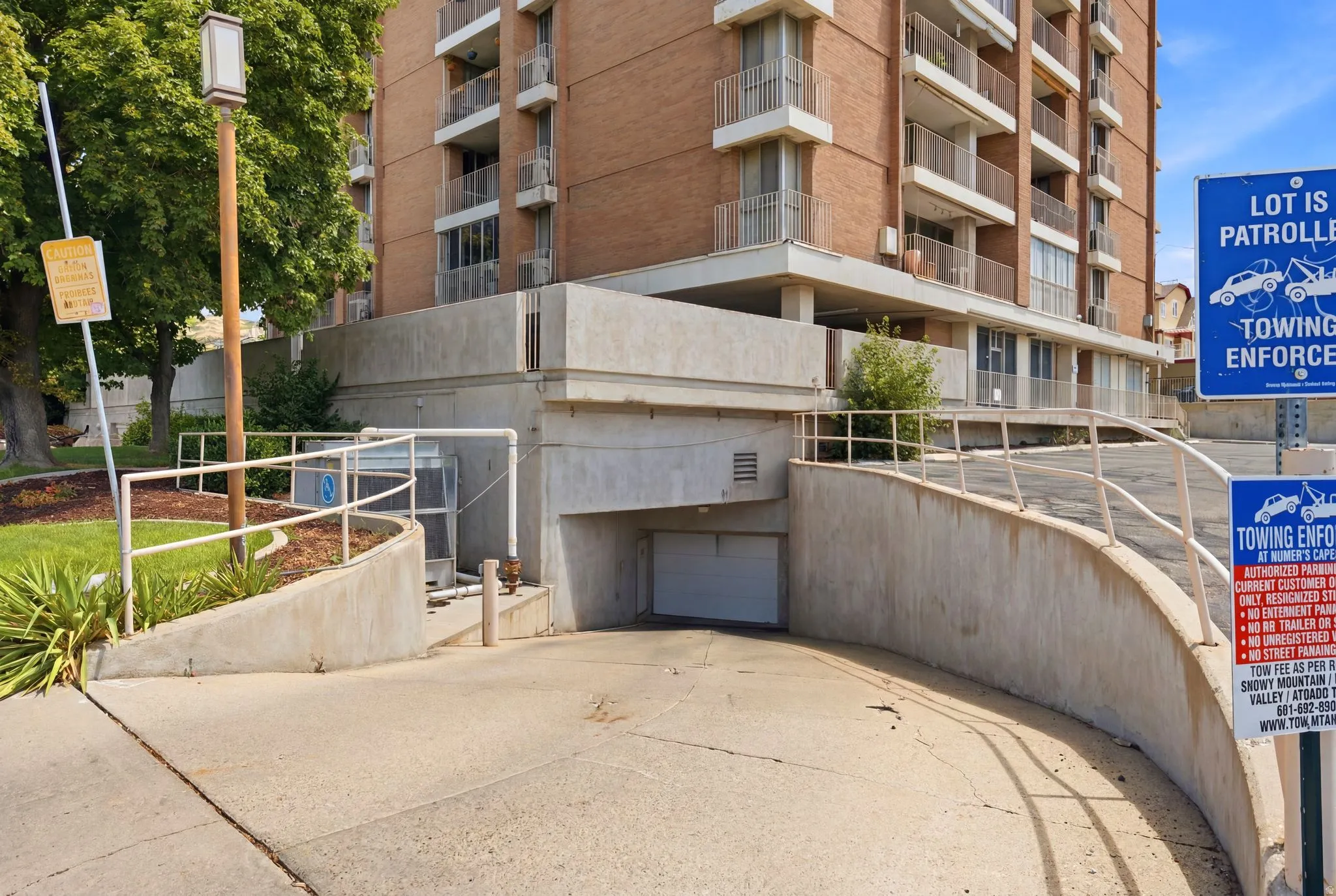 Concrete ramp leading to subterranean parking garage