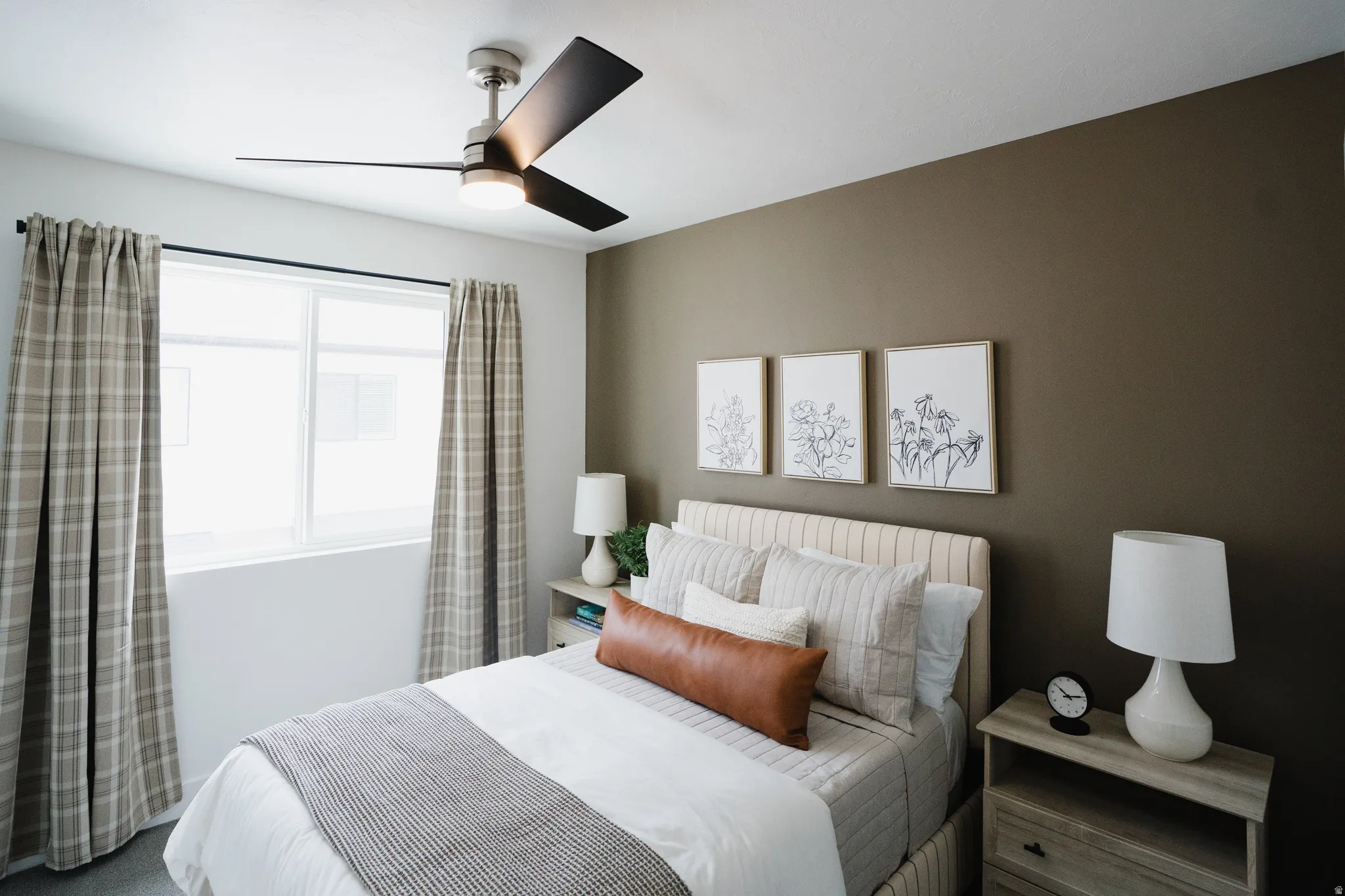 Bedroom featuring a modern ceiling fan with integrated lighting