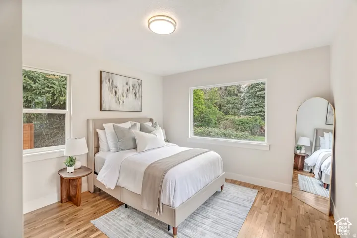 Light-colored wood flooring complements the neutral wall tones