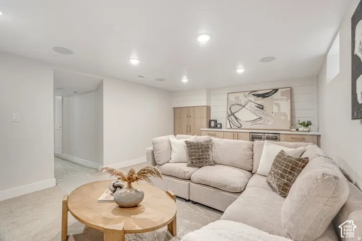 Recreation room featuring recessed lighting, in-ceiling speakers, and neutral carpeting