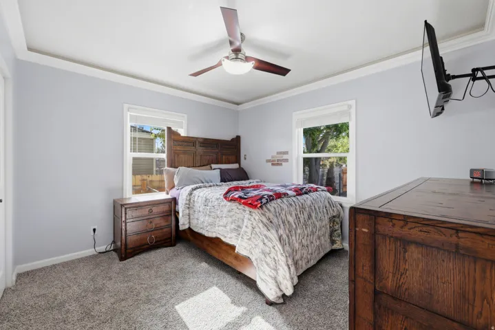 Room featuring light-toned wall paint and crown molding