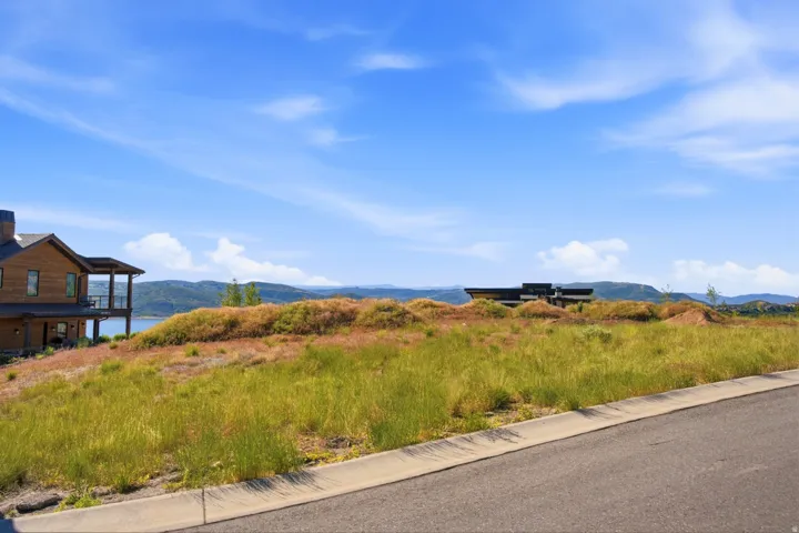 Expansive building lot featuring natural grass and rolling terrain