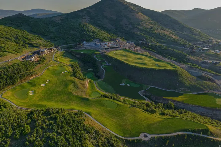 Expansive golf course landscape with multiple greens and sand traps