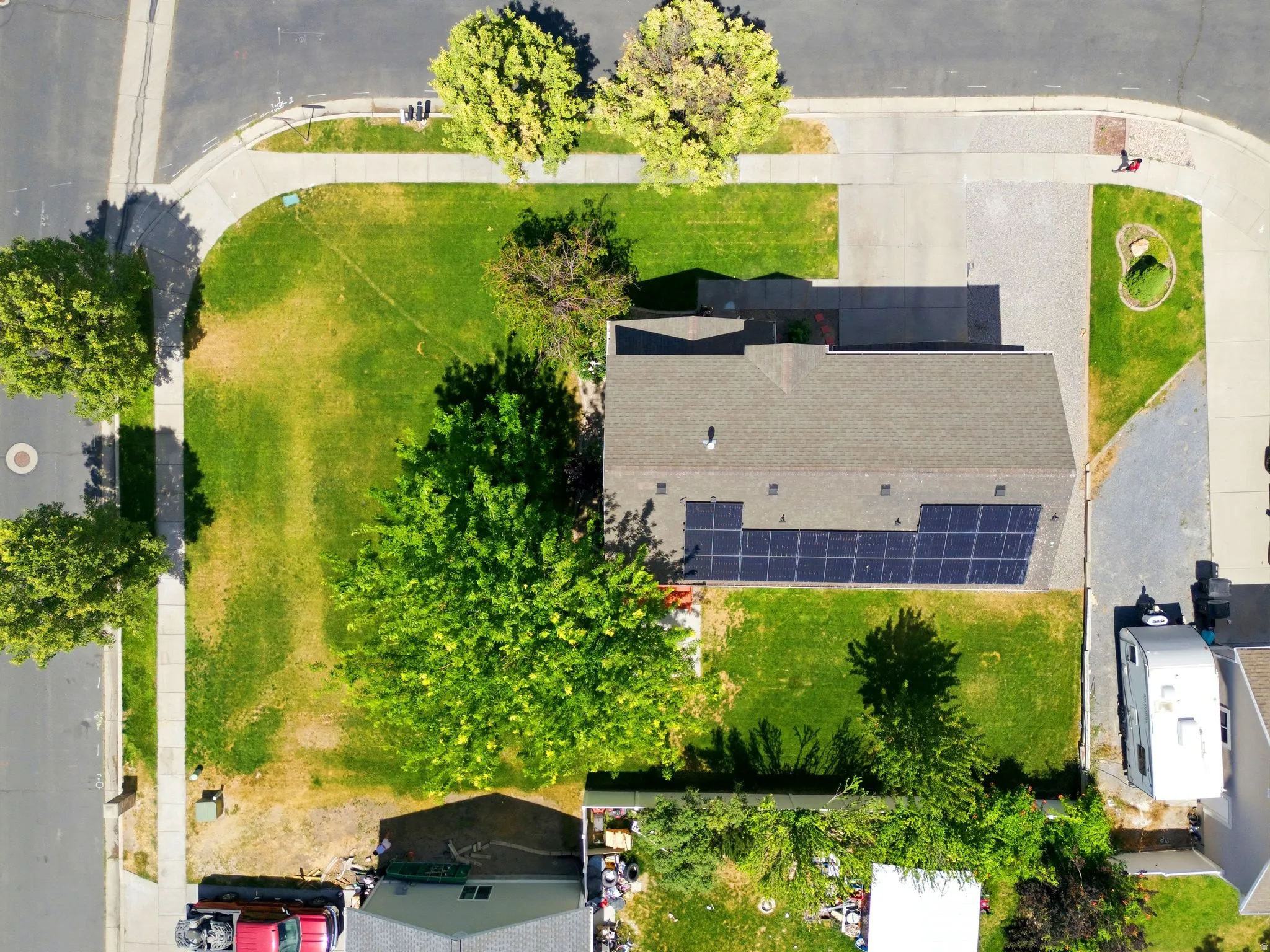 Aerial perspective showcasing a corner lot property