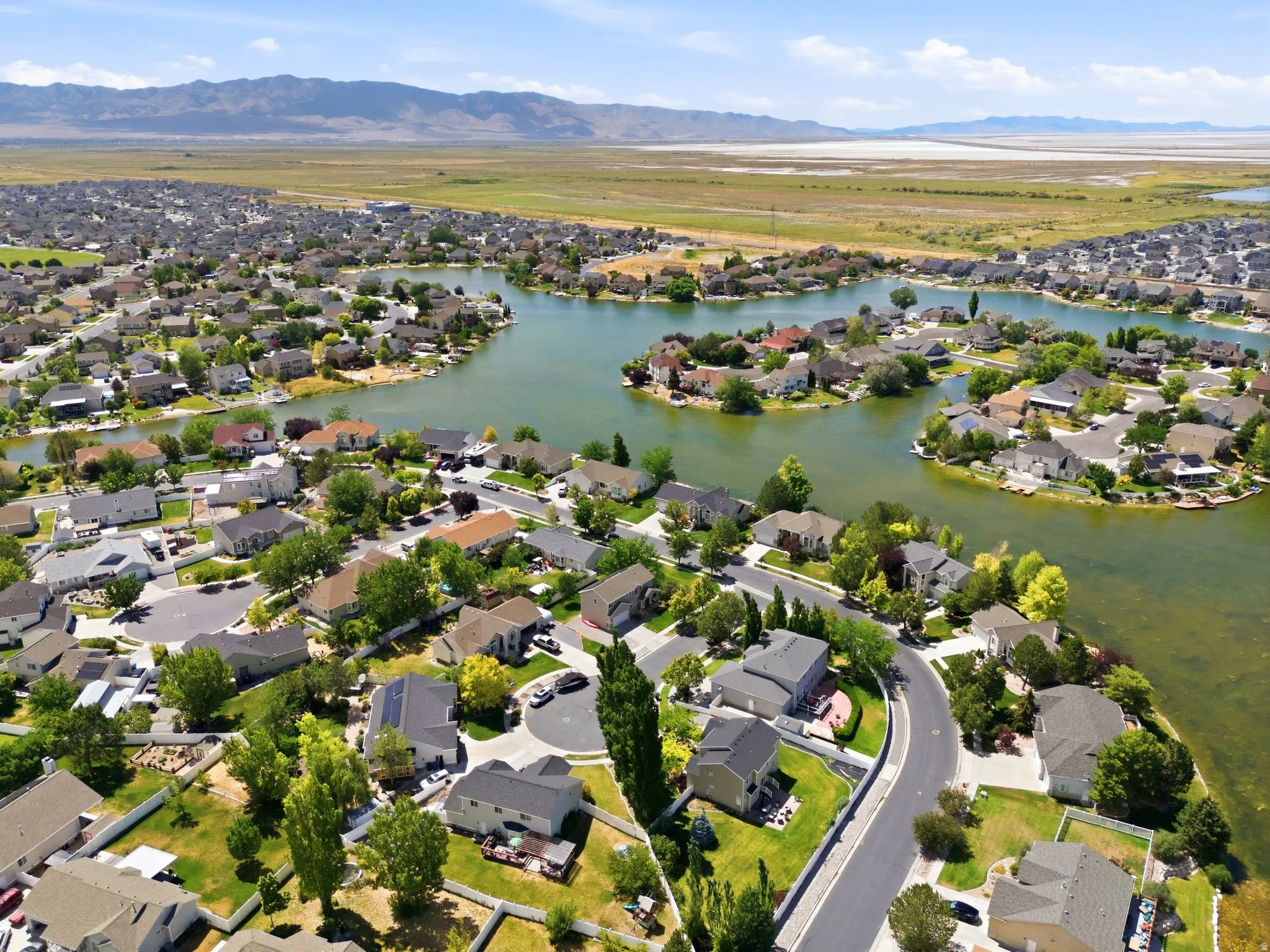 Aerial perspective showcasing a residential community with water features