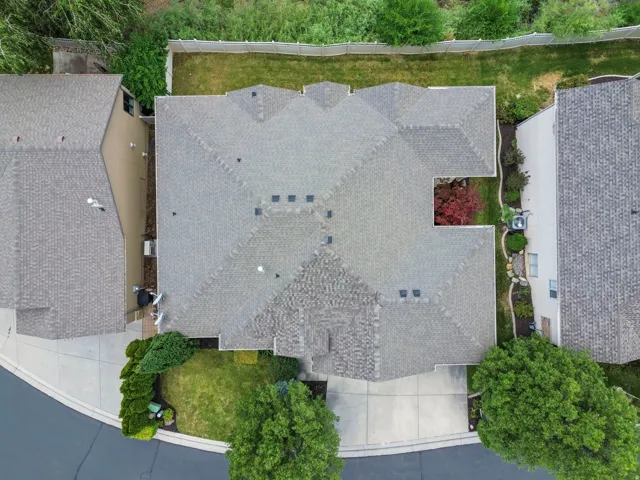 Shingle roof with multiple gables and a central courtyard