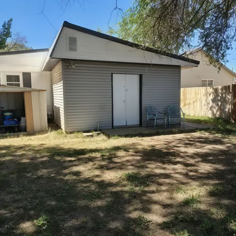 Heated shed with work bench and cabinets
