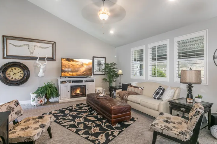 Vaulted ceilings featuring recessed lighting and a ceiling fan
