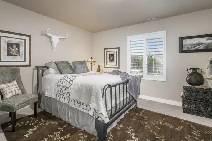 Neutral wall color with white baseboards and window trim