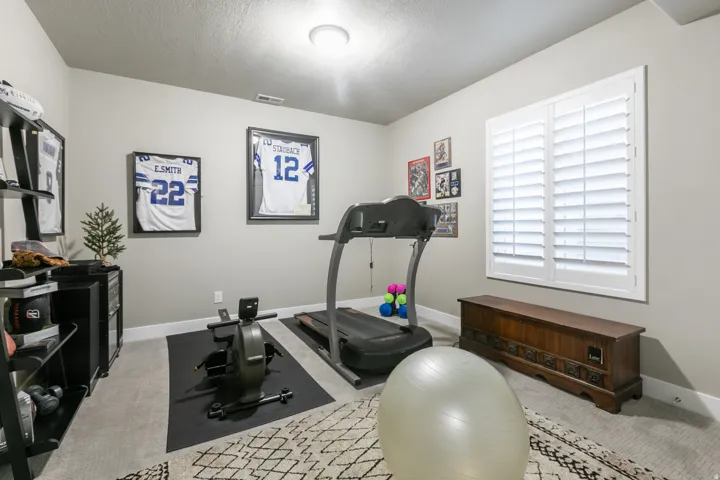 Room featuring light neutral wall paint, white trim, and a ceiling light fixture