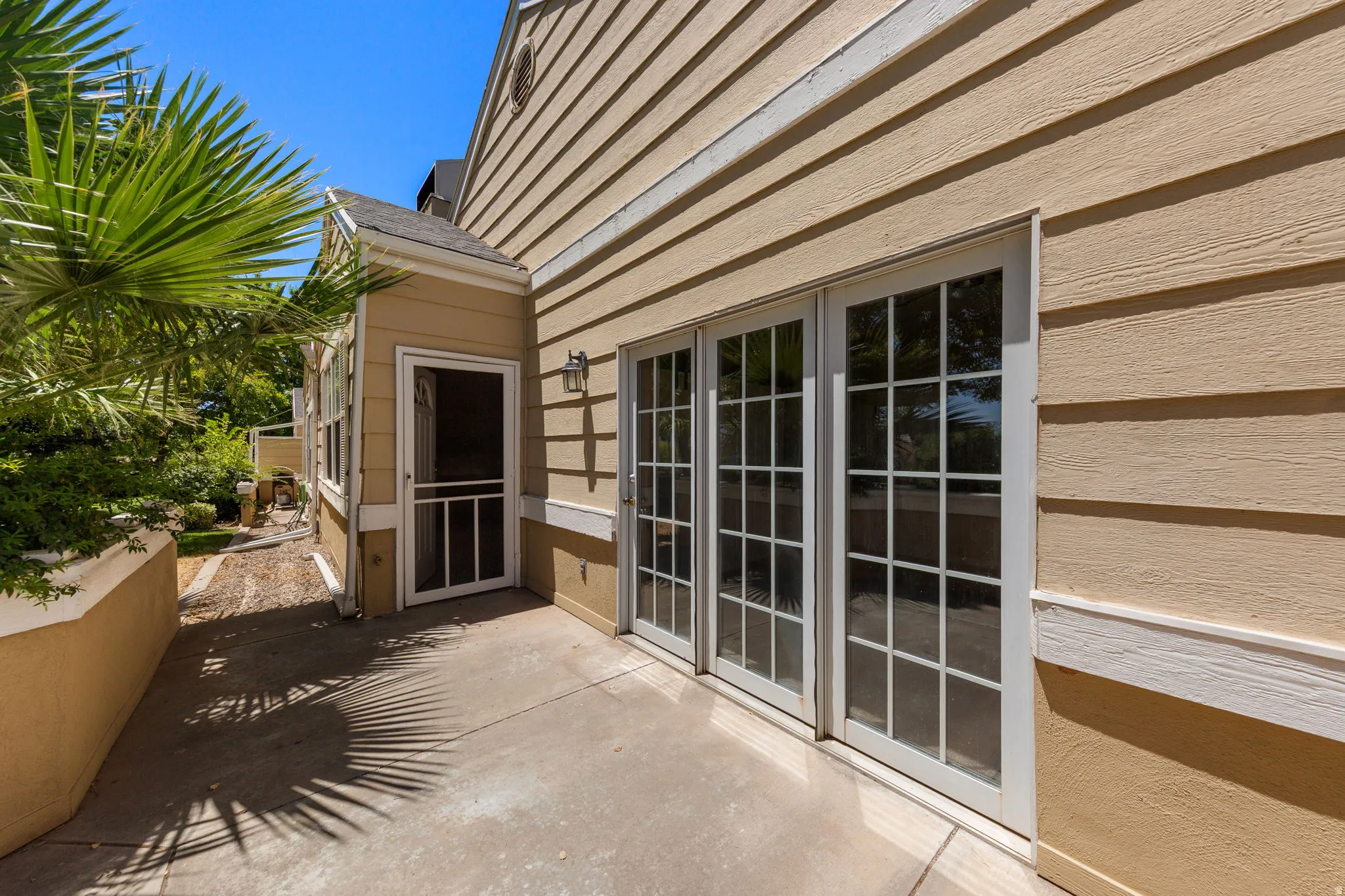 Private patio with concrete flooring