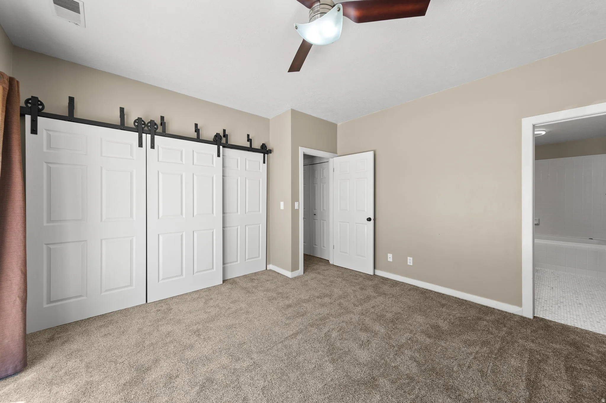 Neutral tone wall color with textured carpeting