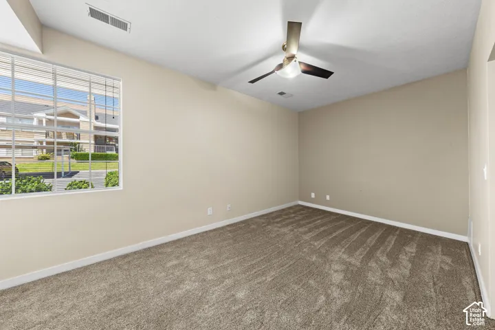 Neutral-toned carpeting throughout the room