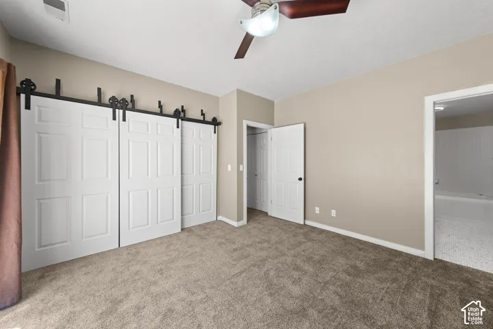 Neutral tone wall color with textured carpeting