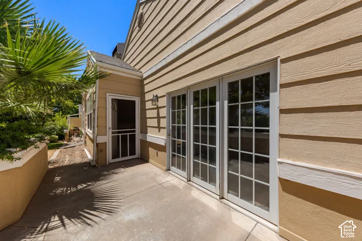 Private patio with concrete flooring