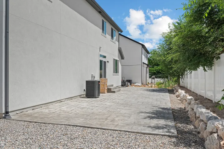 Expansive stamped concrete patio providing outdoor living space