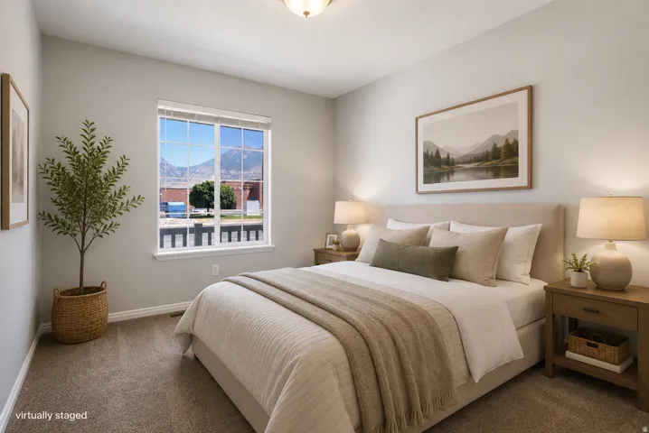 Light-toned walls complement the neutral carpet flooring
