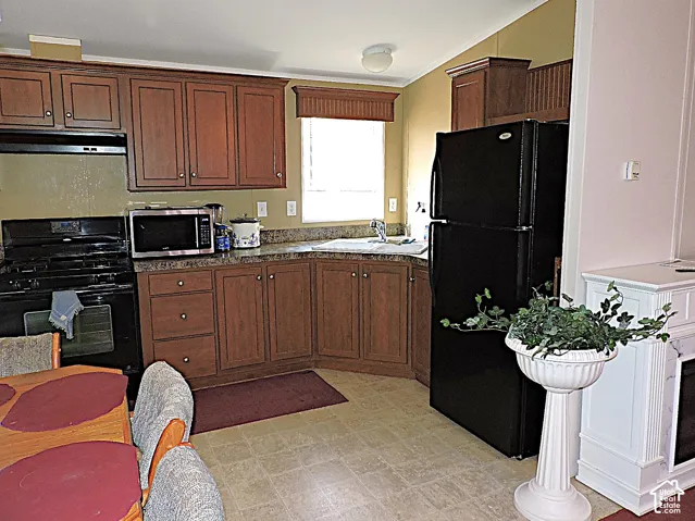 Kitchen featuring wood-finish cabinetry