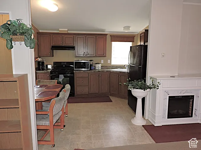 Spacious kitchen featuring rich wood cabinetry, stainless steel appliances, and ample counter workspace