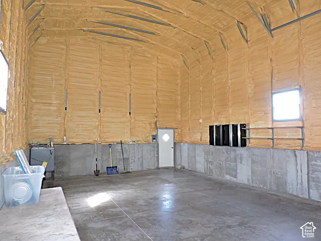 Concrete flooring, insulated walls, and exposed structural beams