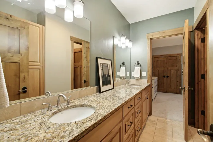 Dual vanity with granite-finish countertop and undermount sinks