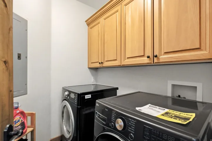 Light wood-finish cabinetry provides overhead storage