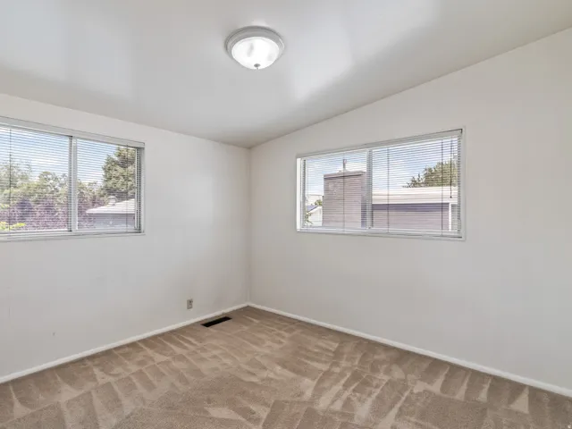 Neutral wall finishes with a flush-mount ceiling light