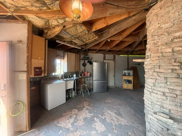 Exposed wooden beams and ceiling insulation provide a unique aesthetic