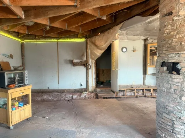 Exposed wood beam ceiling structure with integrated perimeter lighting