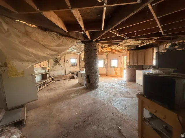Exposed ceiling joists and framework define this expansive interior space