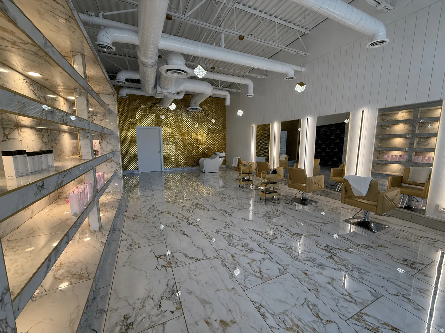 High-gloss marble-look flooring throughout
