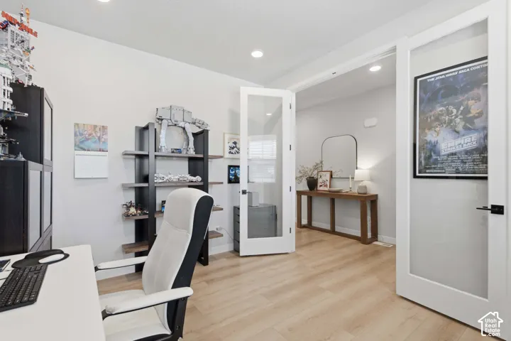 Light wood-finish flooring complements the neutral wall color