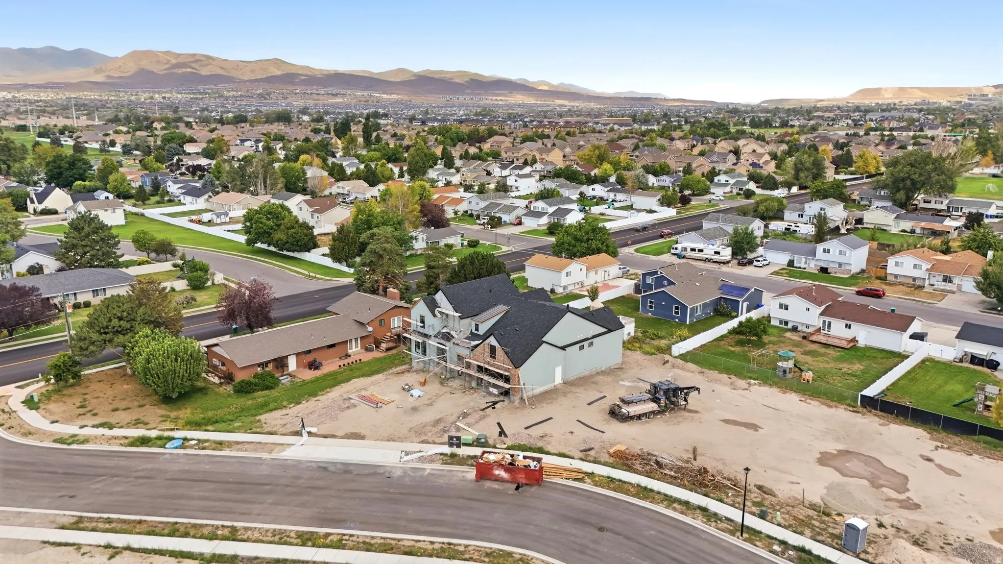 New construction with a multi-level design and a dark shingle roof