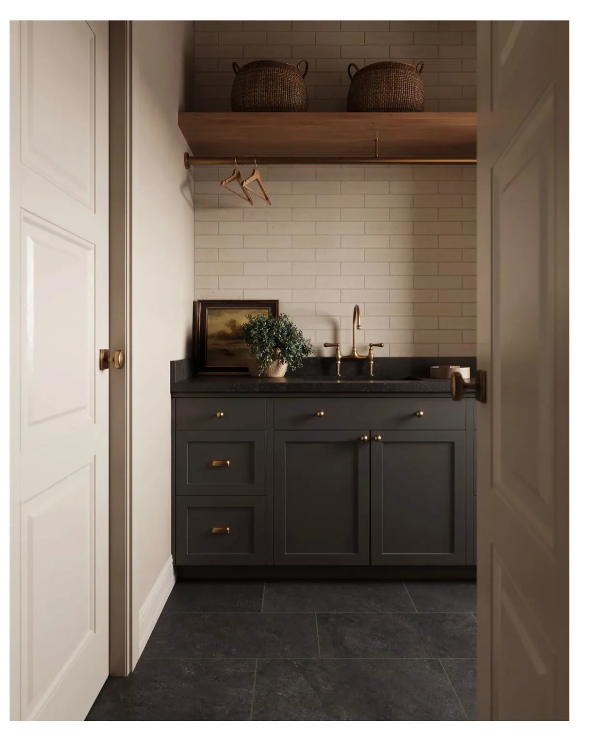 Dedicated utility space featuring dark shaker-style cabinetry, a dark countertop, and a white subway tile backsplash