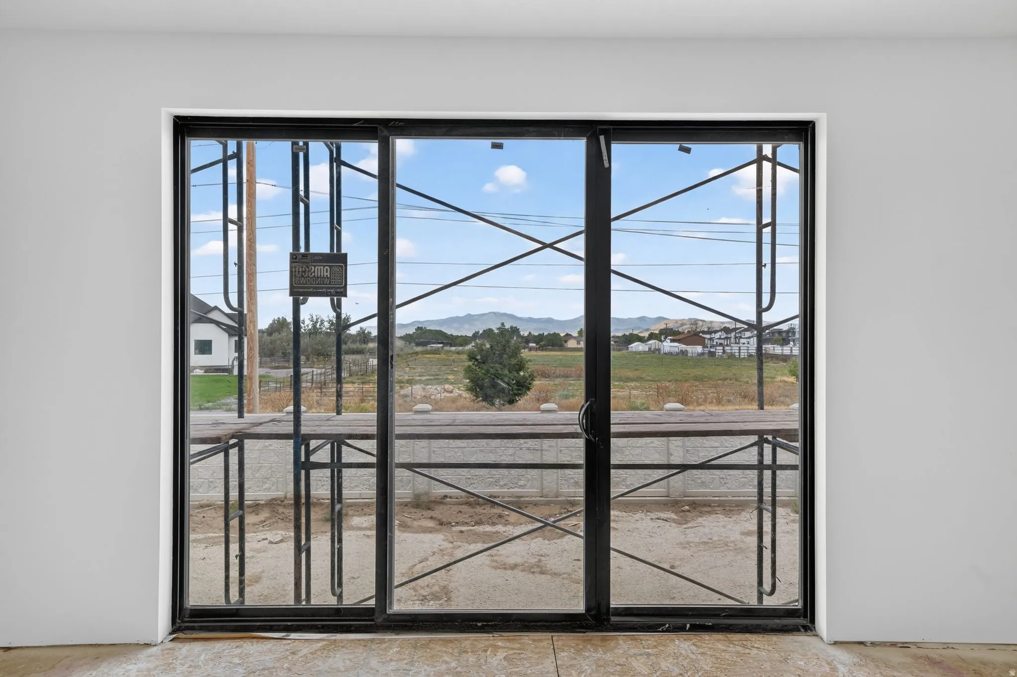 Expansive sliding glass doors with black framing